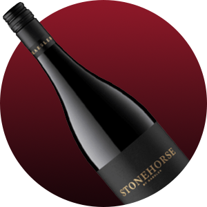 Slanted dark wine bottle with a Stonehorse label against a burgundy gradient background.