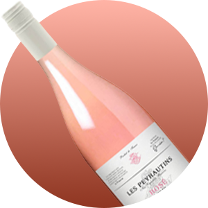 Pink rosé wine bottle angled diagonally against a brown gradient background, with a white label visible on the lower portion.