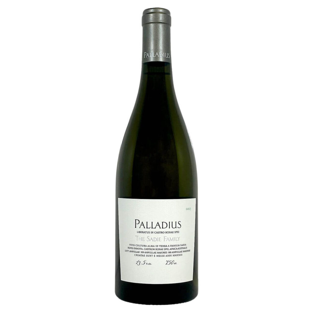 Wine bottle with white Palladius label reading 'The Sadie Family' and silver capsule on top.
