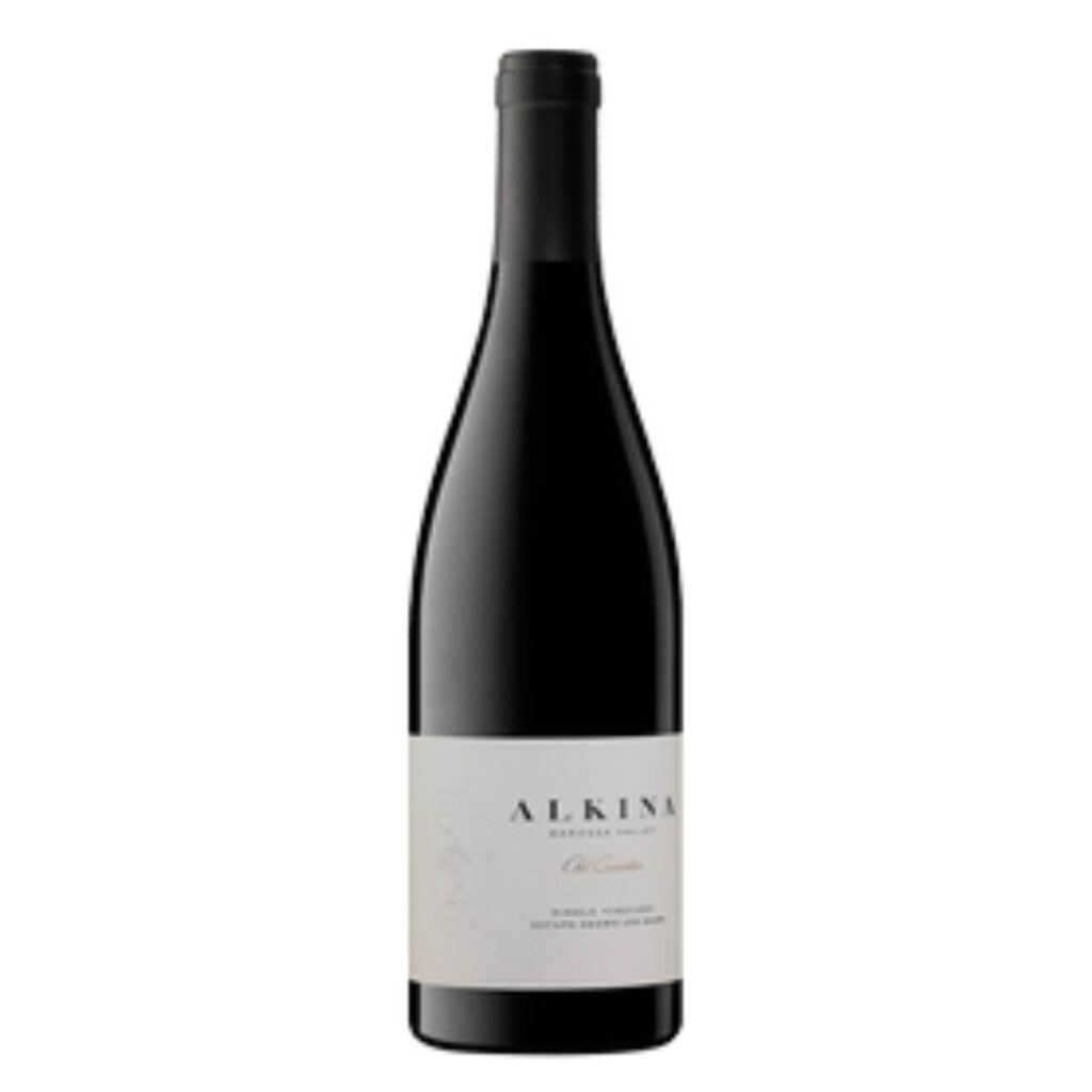 Tall dark wine bottle with a pale label, standing upright. (Red wine)