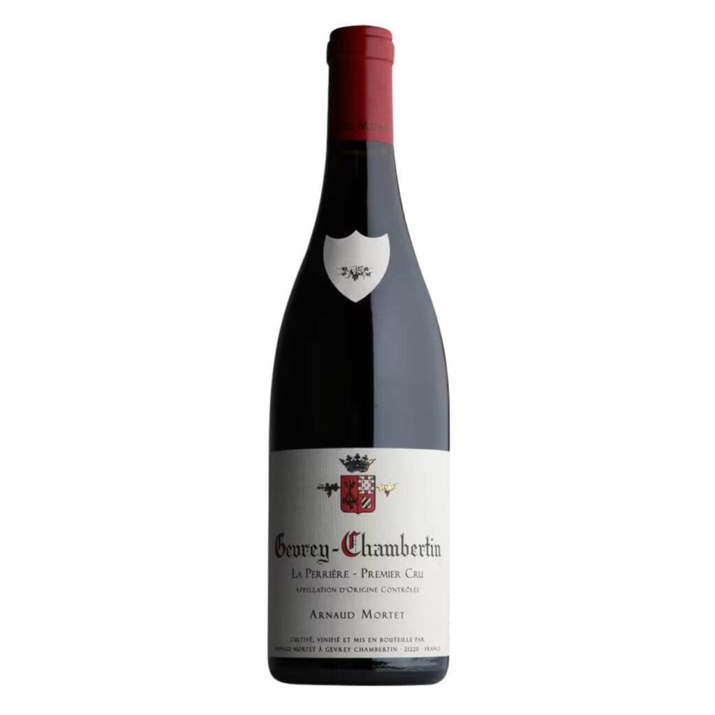 Bottle of Gevrey-Chambertin La Perrière Premier Cru by Arnaud Mortet with red capsule on a white label background (Burgundy wine).
