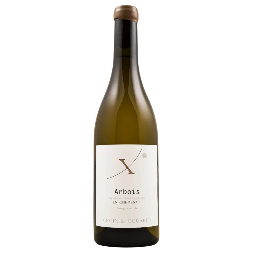 Bottle of white wine with a white label showing 'Arbois' and 'Croix & Courbet' on a plain background