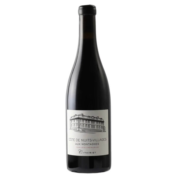 Bottle of red wine with a white label featuring a sketch of a building and the text Côte de Nuits-Villages Aux Montagnes