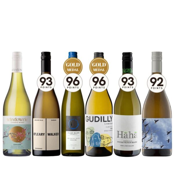 Row of six wine bottles with score badges (93, 96, 96, 93, 92) and gold medal stickers on the necks, from left to right.