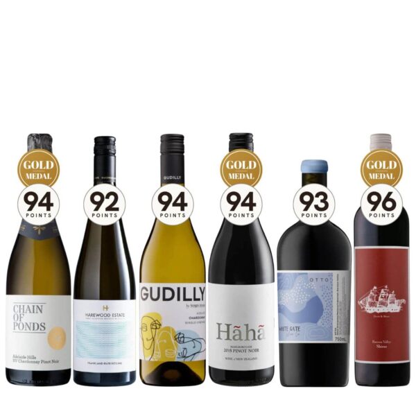 Six wine bottles in a row with gold medal seals on top, labels read Chain of Ponds, Harewood Estate, Gudili(y), Hāha Pinot Noir, White Gate, and a sailing-ship bottle, on a white background.